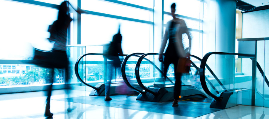 image of people on a busy escalator