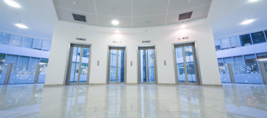 image of a modern plush office with four lifts